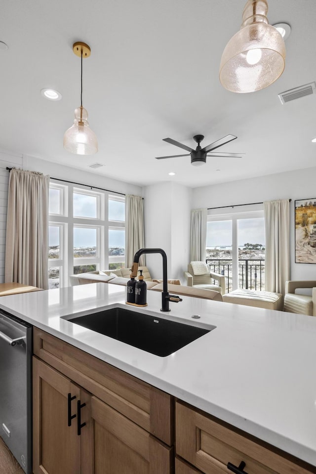 34 Gulf Breeze Ct, Destin, FL 32541 - kitchen with stainless steel dishwasher, a sink, visible vents, and plenty of natural light