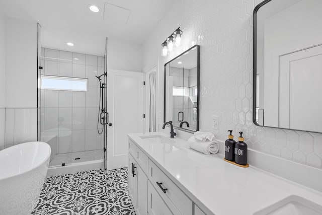 34 Gulf Breeze Ct, Destin, FL 32541 - full bath featuring recessed lighting, double vanity, a sink, a freestanding tub, and a stall shower