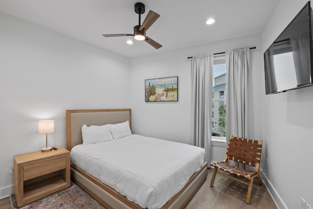34 Gulf Breeze Ct, Destin, FL 32541 - bedroom with wood finished floors, baseboards, multiple windows, and recessed lighting