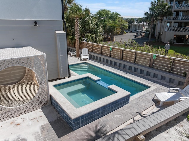 34 Gulf Breeze Ct, Destin, FL 32541 - view of pool featuring a pool with connected hot tub, a patio, and fence