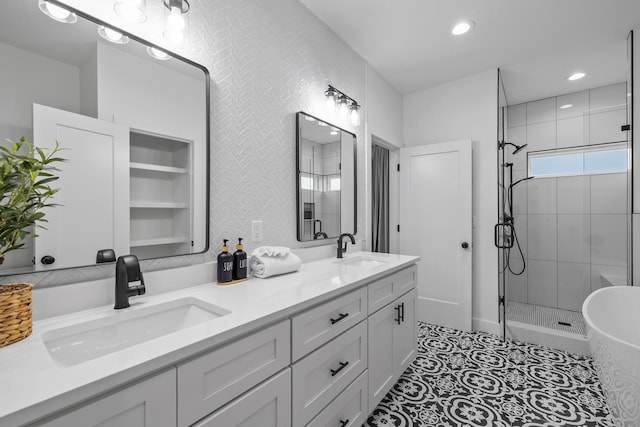 34 Gulf Breeze Ct, Destin, FL 32541 - bathroom with a shower stall, recessed lighting, double vanity, and a sink