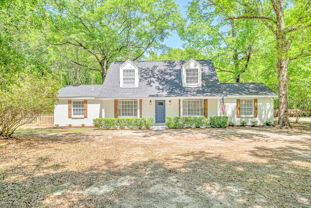 5700 Country Squire Dr, Milton, FL 32570 - cape cod home featuring brick siding and fence
