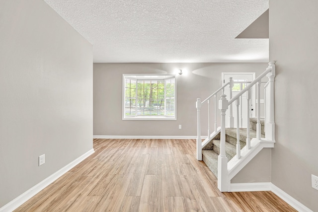 5700 Country Squire Dr, Milton, FL 32570 - interior space with baseboards, wood finished floors, and a textured ceiling