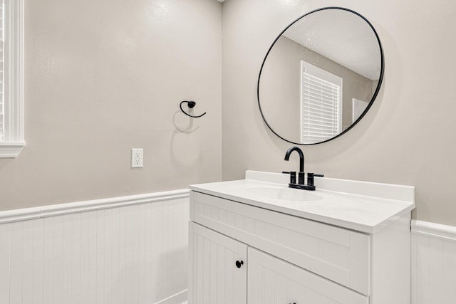 5700 Country Squire Dr, Milton, FL 32570 - bathroom with vanity and a wainscoted wall