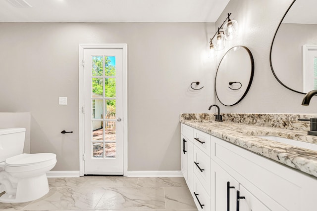 5700 Country Squire Dr, Milton, FL 32570 - full bath with toilet, baseboards, marble finish floor, and a sink