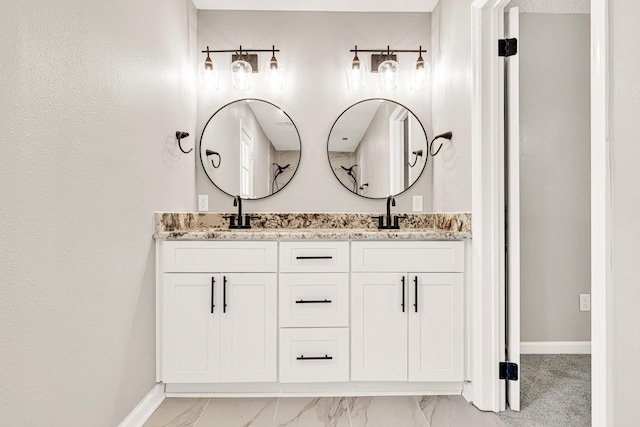 5700 Country Squire Dr, Milton, FL 32570 - bathroom with a sink, baseboards, and double vanity