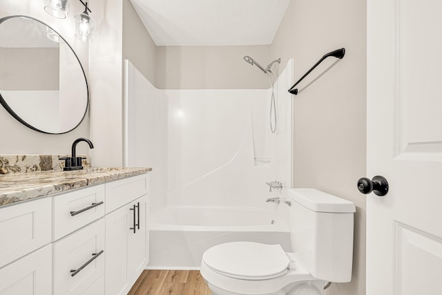 5700 Country Squire Dr, Milton, FL 32570 - bathroom with vanity,  shower combination, a textured ceiling, toilet, and wood finished floors