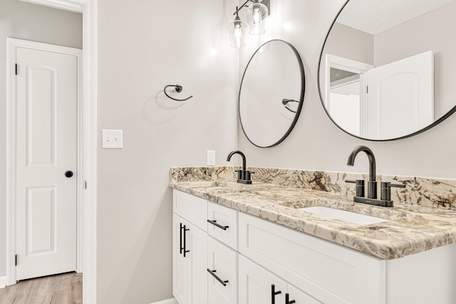 5700 Country Squire Dr, Milton, FL 32570 - bathroom featuring double vanity, baseboards, and a sink