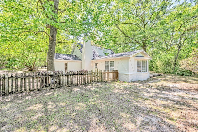 5700 Country Squire Dr, Milton, FL 32570 - exterior space with brick siding, fence, and a chimney