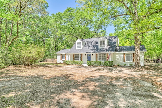 5700 Country Squire Dr, Milton, FL 32570 - new england style home featuring roof with shingles and fence