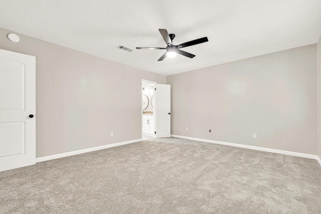 5700 Country Squire Dr, Milton, FL 32570 - carpeted spare room featuring visible vents, baseboards, a ceiling fan, and a textured ceiling