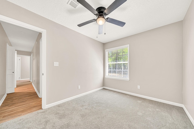 5700 Country Squire Dr, Milton, FL 32570 - empty room with ceiling fan, a textured ceiling, visible vents, carpet flooring, and baseboards