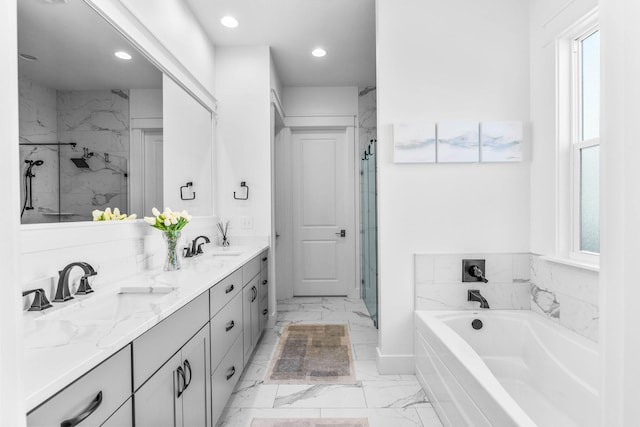 141 Sandchase Cir, Watersound, FL 32461 - bathroom featuring plenty of natural light, marble finish floor, a sink, and a marble finish shower