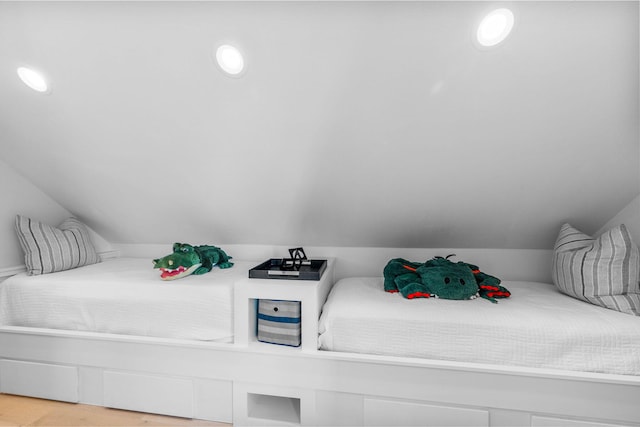 141 Sandchase Cir, Watersound, FL 32461 - bedroom featuring wood finished floors and vaulted ceiling