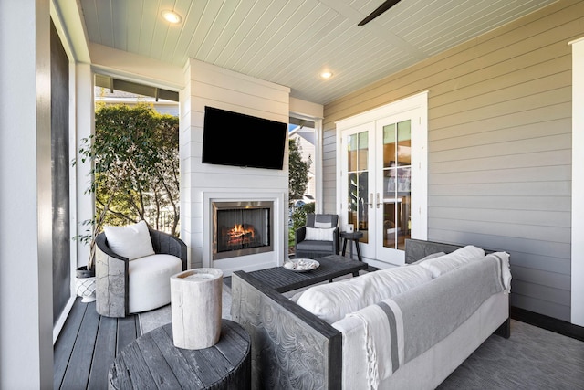 141 Sandchase Cir, Watersound, FL 32461 - exterior space featuring french doors and an outdoor living space with a fireplace