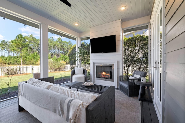 141 Sandchase Cir, Watersound, FL 32461 - sunroom with plenty of natural light and an outdoor living space with a fireplace