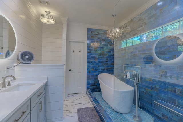 4030 Indian Trl, Destin, FL 32541 - full bath with an inviting chandelier, vanity, ornamental molding, marble finish floor, and a freestanding bath