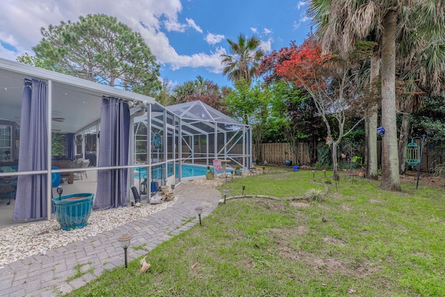 4030 Indian Trl, Destin, FL 32541 - view of yard featuring a lanai, a fenced backyard, and a fenced in pool