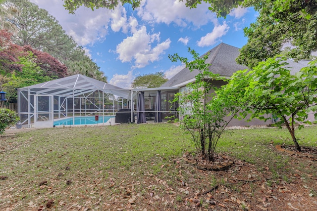 4030 Indian Trl, Destin, FL 32541 - view of yard with an outdoor pool and a lanai