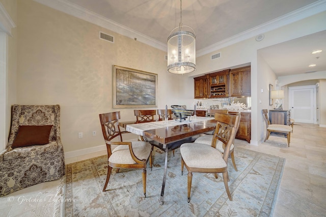 11807 Front Beach Rd Unit 2104, Panama City Beach, FL 32407 - dining room with arched walkways, visible vents, ornamental molding, and an inviting chandelier