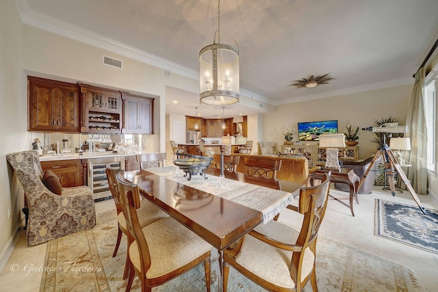 11807 Front Beach Rd Unit 2104, Panama City Beach, FL 32407 - dining room with wet bar, visible vents, ornamental molding, and wine cooler