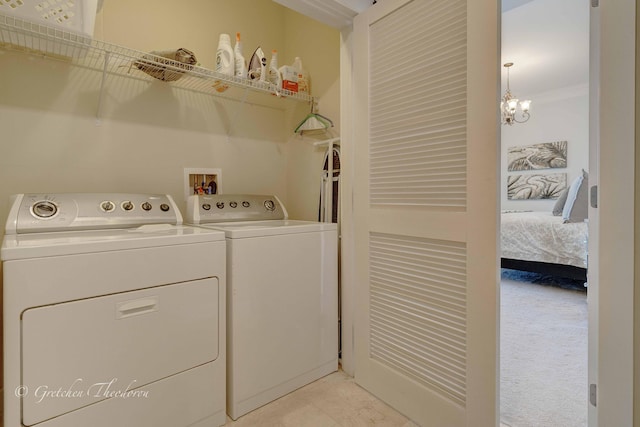 11807 Front Beach Rd Unit 2104, Panama City Beach, FL 32407 - washroom featuring a notable chandelier, washer and clothes dryer, and laundry area