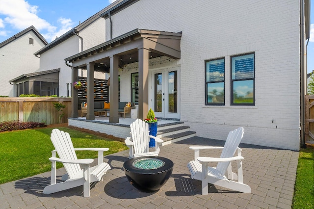 331 Ridgewalk Cir, Santa Rosa Beach, FL 32459 - view of patio / terrace with a fire pit, fence, and french doors