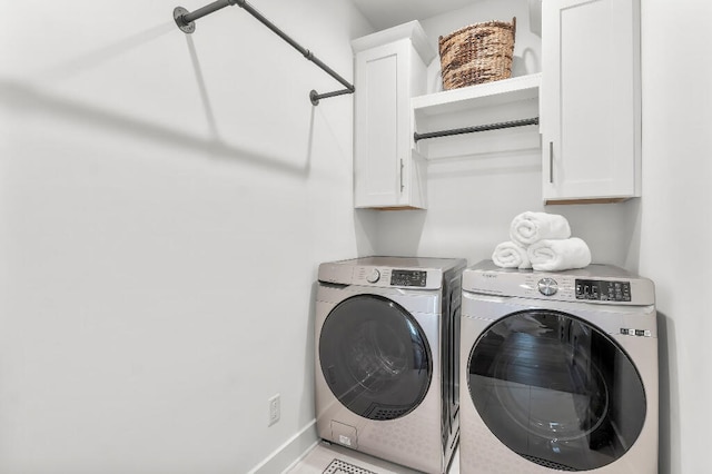 331 Ridgewalk Cir, Santa Rosa Beach, FL 32459 - laundry room featuring washing machine and clothes dryer, cabinet space, and baseboards