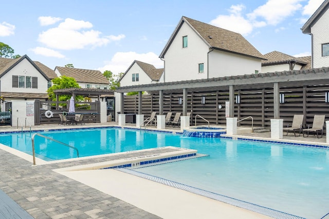 331 Ridgewalk Cir, Santa Rosa Beach, FL 32459 - community pool featuring fence, a pergola, a hot tub, and a patio