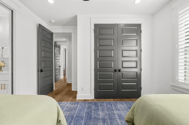 331 Ridgewalk Cir, Santa Rosa Beach, FL 32459 - bedroom with dark wood-type flooring, baseboards, recessed lighting, and a closet