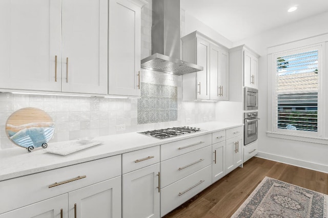 331 Ridgewalk Cir, Santa Rosa Beach, FL 32459 - kitchen with wall chimney range hood, tasteful backsplash, white cabinets, stainless steel appliances, and dark wood finished floors