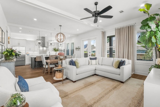 331 Ridgewalk Cir, Santa Rosa Beach, FL 32459 - living area featuring recessed lighting, ceiling fan with notable chandelier, visible vents, and light wood-type flooring