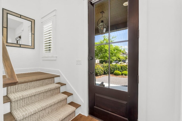 331 Ridgewalk Cir, Santa Rosa Beach, FL 32459 - doorway to outside featuring wood finished floors, a healthy amount of sunlight, and stairway