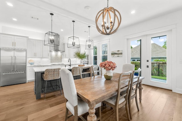 331 Ridgewalk Cir, Santa Rosa Beach, FL 32459 - dining space featuring a chandelier, light wood-type flooring, visible vents, and recessed lighting