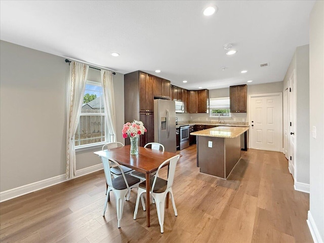 2055 Bright Water Dr, Gulf Breeze, FL 32563 - kitchen with stainless steel appliances, plenty of natural light, a sink, baseboards, and recessed lighting