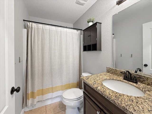 2055 Bright Water Dr, Gulf Breeze, FL 32563 - full bathroom with toilet, vanity, a textured ceiling, a shower with curtain, and tile patterned floors