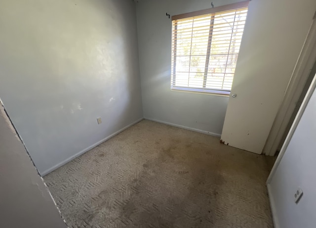 empty room featuring carpet flooring