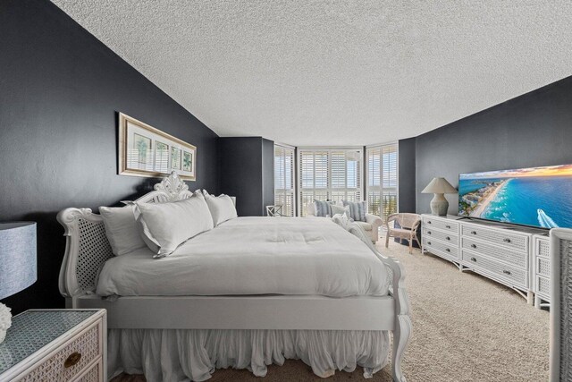 11619 Front Beach Rd Unit 201, Panama City Beach, FL 32407 - bedroom with carpet and a textured ceiling