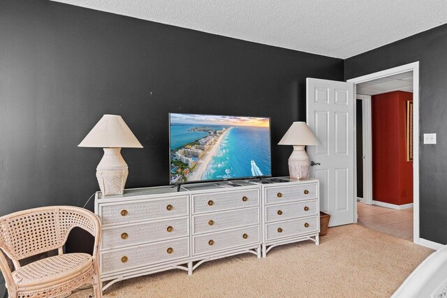 11619 Front Beach Rd Unit 201, Panama City Beach, FL 32407 - sitting room with a textured ceiling, light tile patterned floors, and baseboards