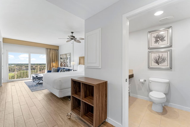 5000 S Sandestin Blvd Unit 6806, Sandestin, FL 32550 - bedroom featuring access to outside, baseboards, and wood finished floors