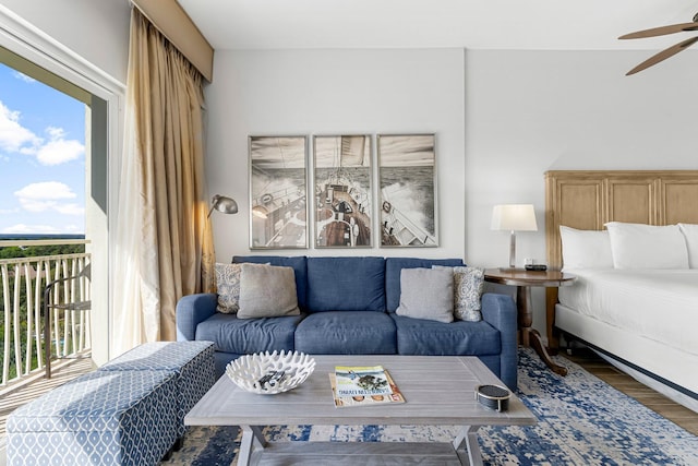 5000 S Sandestin Blvd Unit 6806, Sandestin, FL 32550 - bedroom featuring access to exterior, multiple windows, and wood finished floors