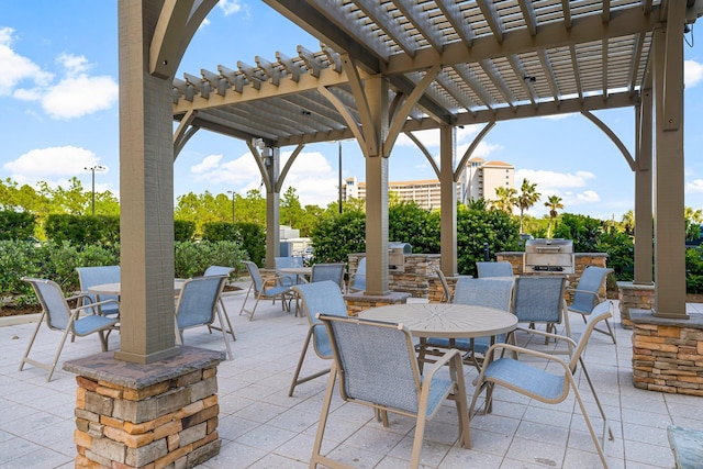 5000 S Sandestin Blvd Unit 6806, Sandestin, FL 32550 - view of patio featuring area for grilling, outdoor dining space, and a pergola