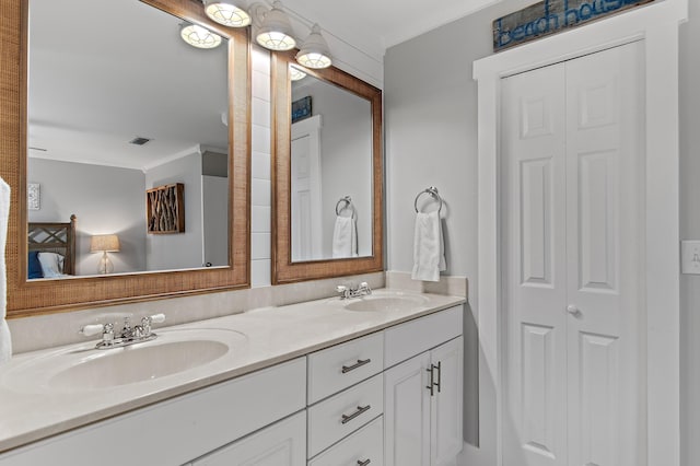 496 Linkside Dr, Miramar Beach, FL 32550 - full bath featuring double vanity, visible vents, a sink, and crown molding