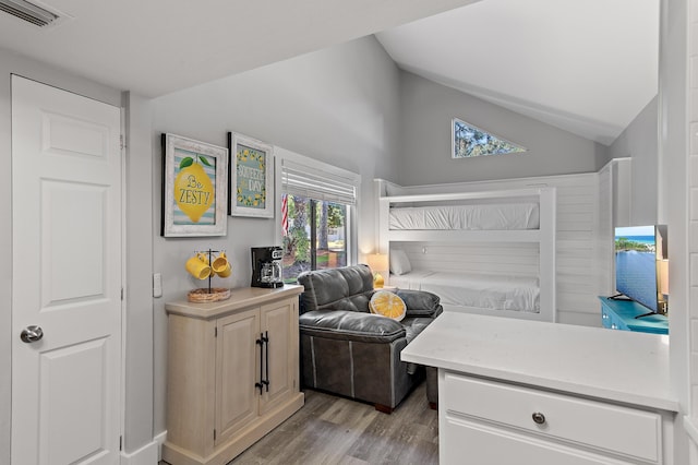 496 Linkside Dr, Miramar Beach, FL 32550 - bedroom with visible vents, light wood-style flooring, and lofted ceiling