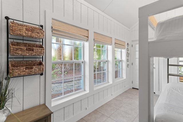 496 Linkside Dr, Miramar Beach, FL 32550 - unfurnished sunroom featuring a wealth of natural light, tile patterned floors, and vaulted ceiling