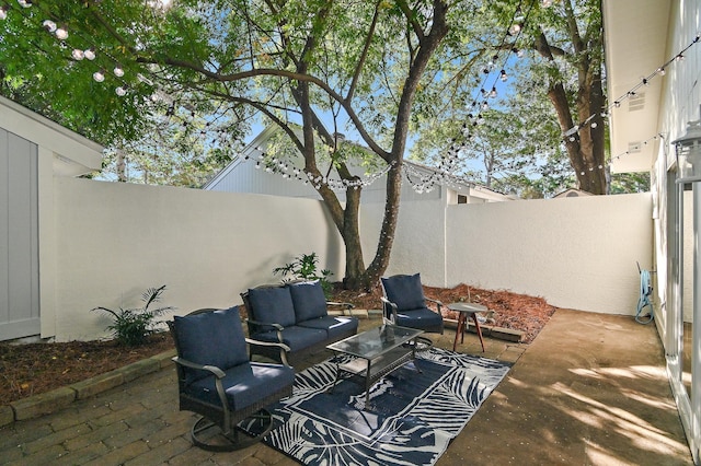 496 Linkside Dr, Miramar Beach, FL 32550 - view of patio with an outdoor living space and a fenced backyard