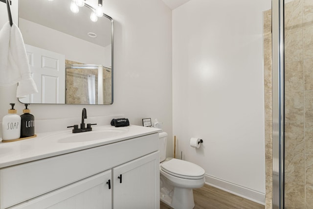 332 Somerset Bridge Rd, Santa Rosa Beach, FL 32459 - full bath featuring toilet, a stall shower, wood finished floors, and vanity