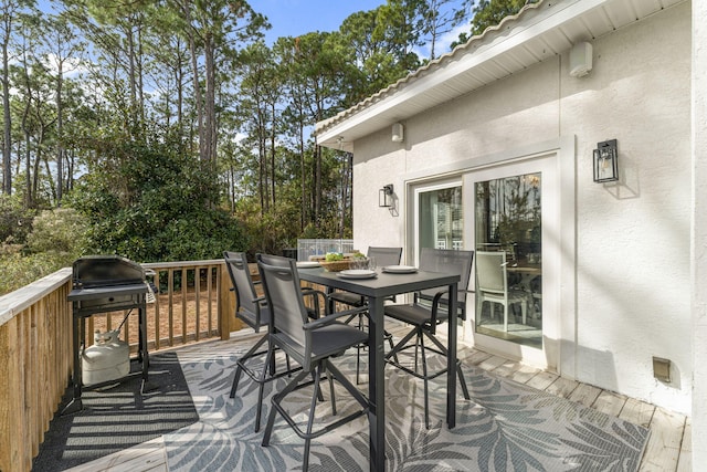 332 Somerset Bridge Rd, Santa Rosa Beach, FL 32459 - wooden terrace with outdoor dining area and area for grilling