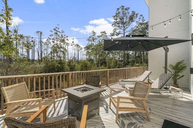 332 Somerset Bridge Rd, Santa Rosa Beach, FL 32459 - wooden deck with an outdoor fire pit