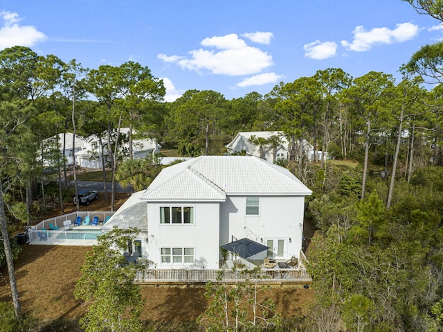 332 Somerset Bridge Rd, Santa Rosa Beach, FL 32459 - back of property featuring a tiled roof, a fenced in pool, and stucco siding
